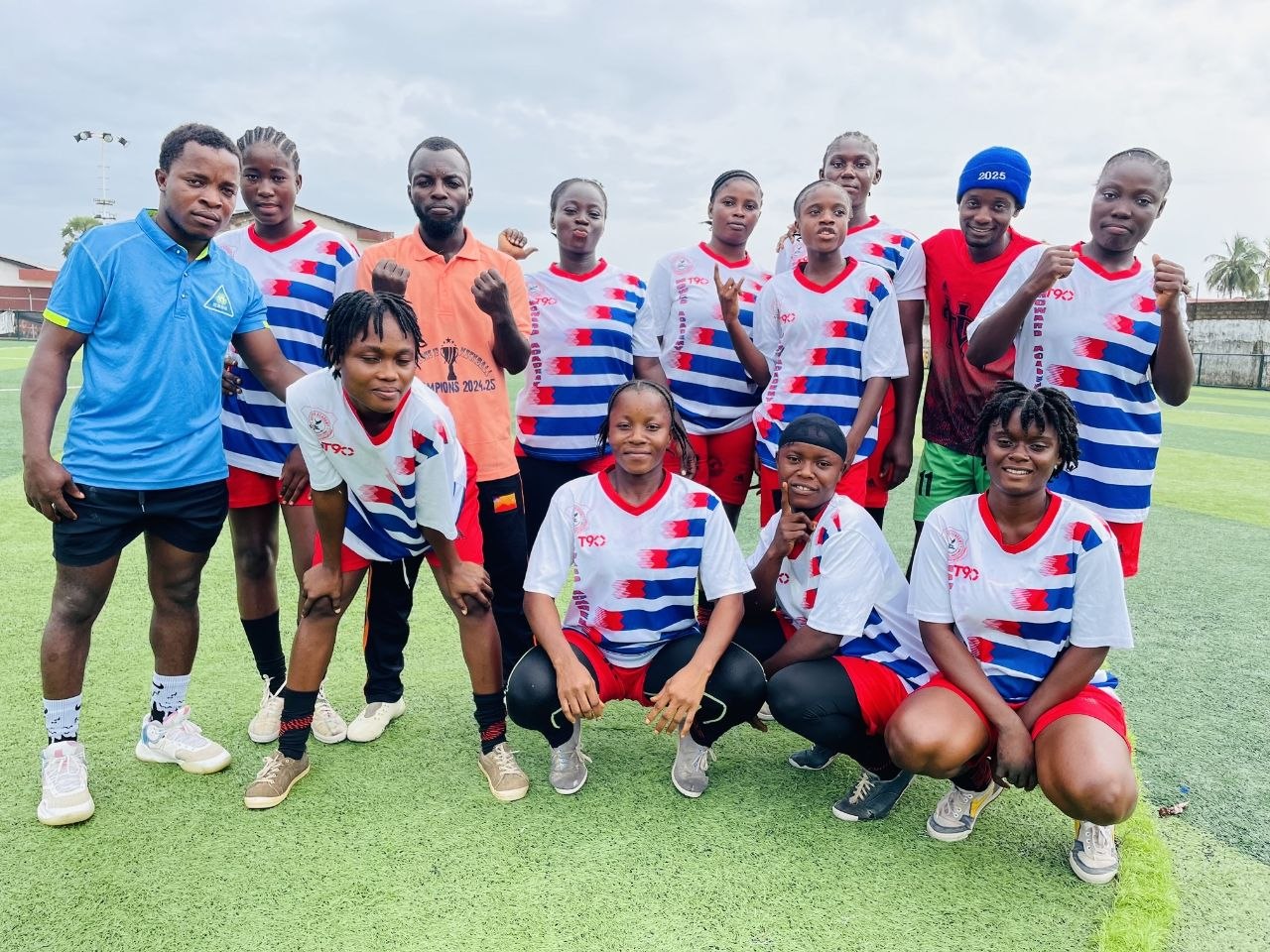 Howard Academy Mighty Eagles girls football team in blue uniform