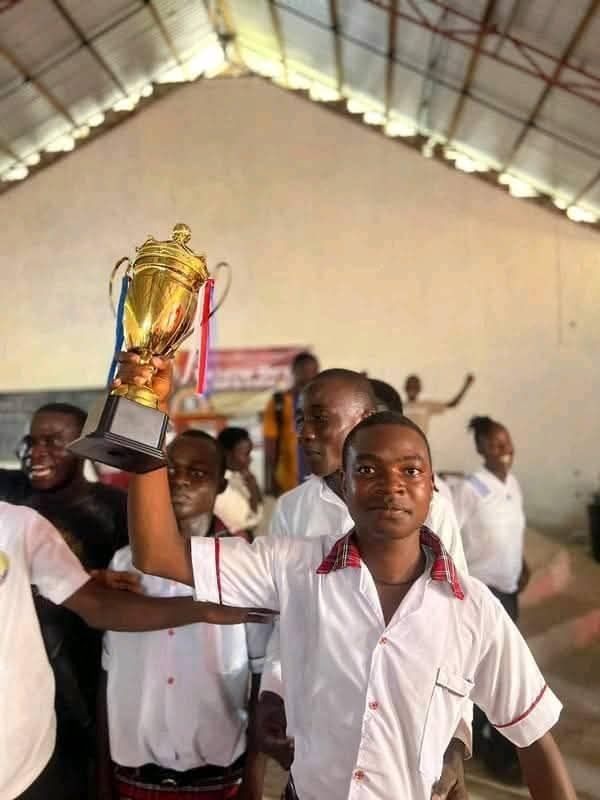 Howard Academy student trophy celebration